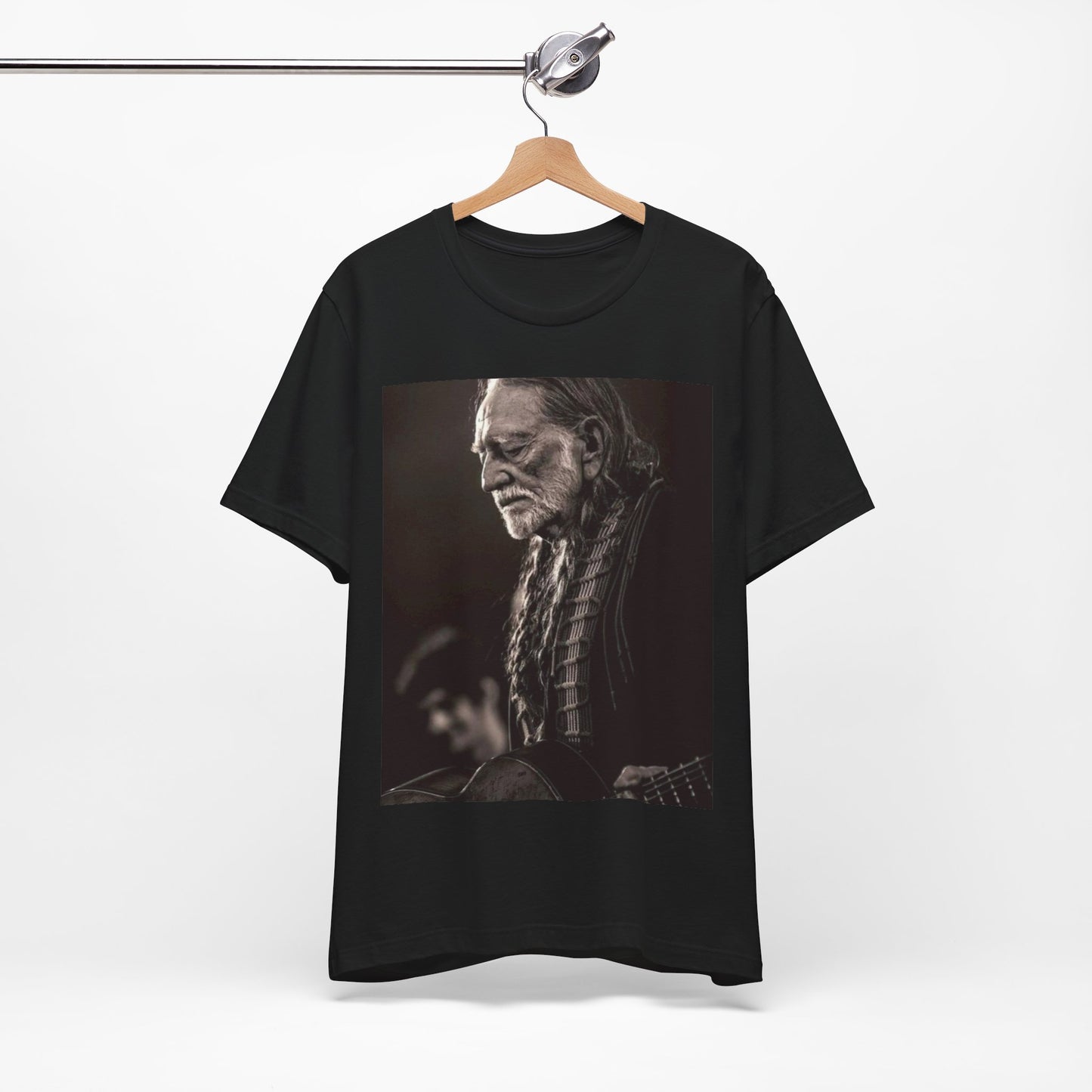 A black graphic t-shirt featuring a vintage country legend graphic of Willie Nelson.