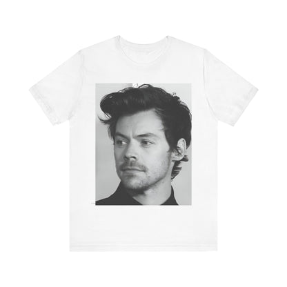 A black graphic t-shirt featuring a black and white, monochrome graphic or photo of Harry Styles.