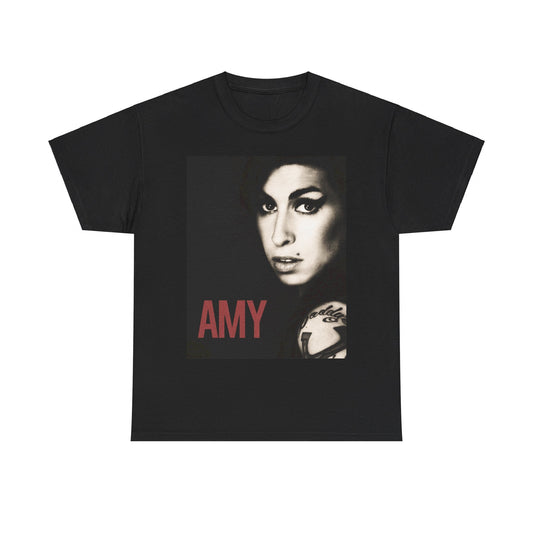 A black graphic t-shirt featuring a stylized graphic of Amy Winehouse, designed to represent her enduring legacy, possibly with her name or iconic elements.