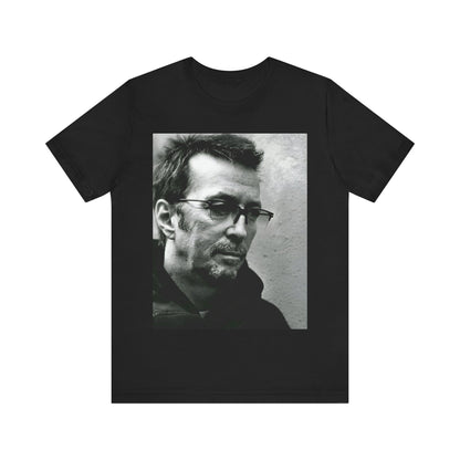 A black graphic t-shirt featuring a black and white, monochrome graphic or photo of Eric Clapton.