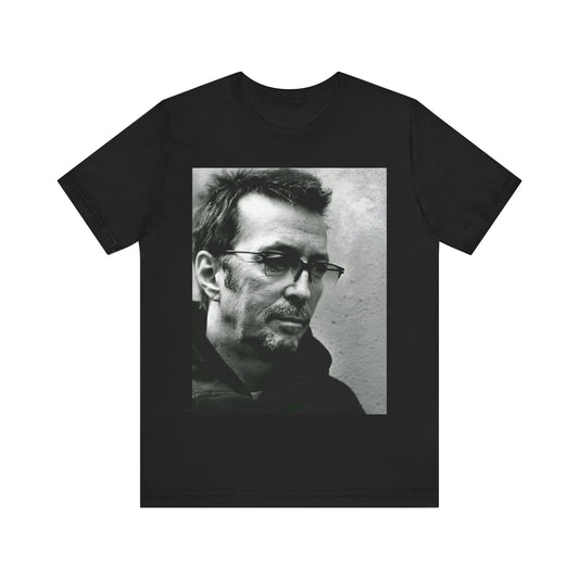 A black graphic t-shirt featuring a black and white, monochrome graphic or photo of Eric Clapton.