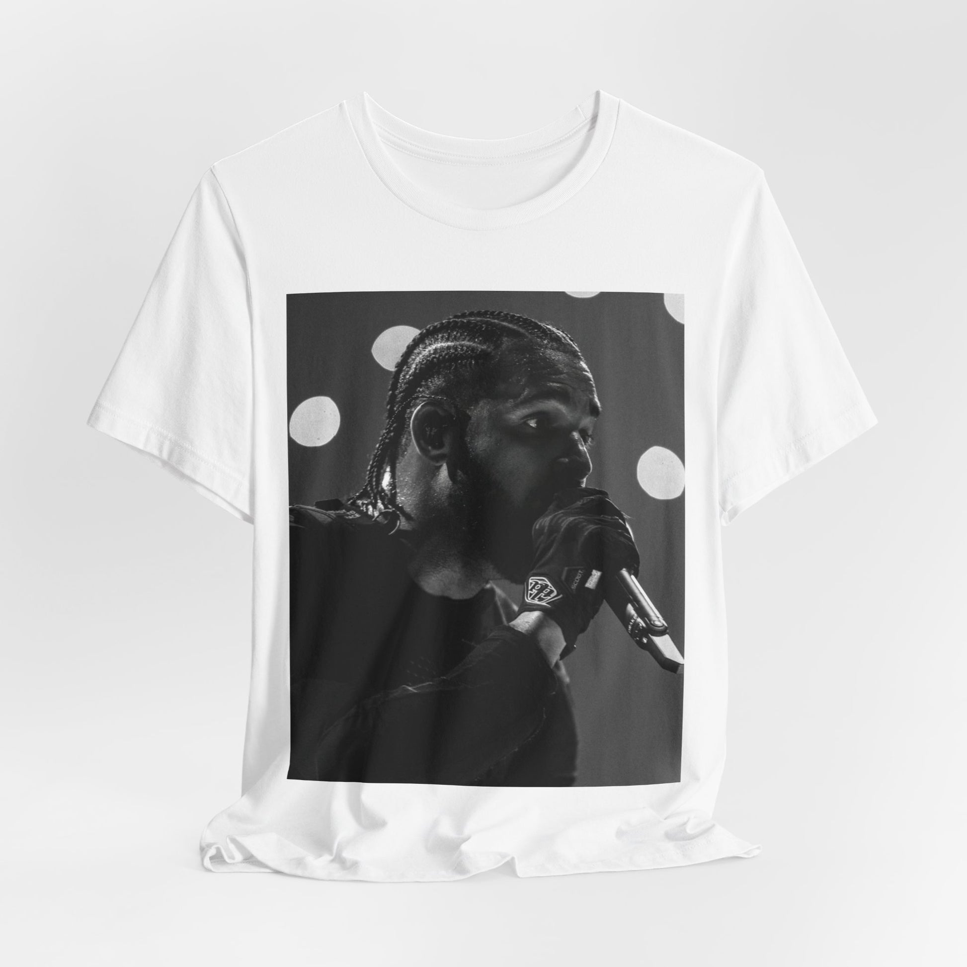 A black graphic t-shirt featuring a classic black and white style graphic of Drake.