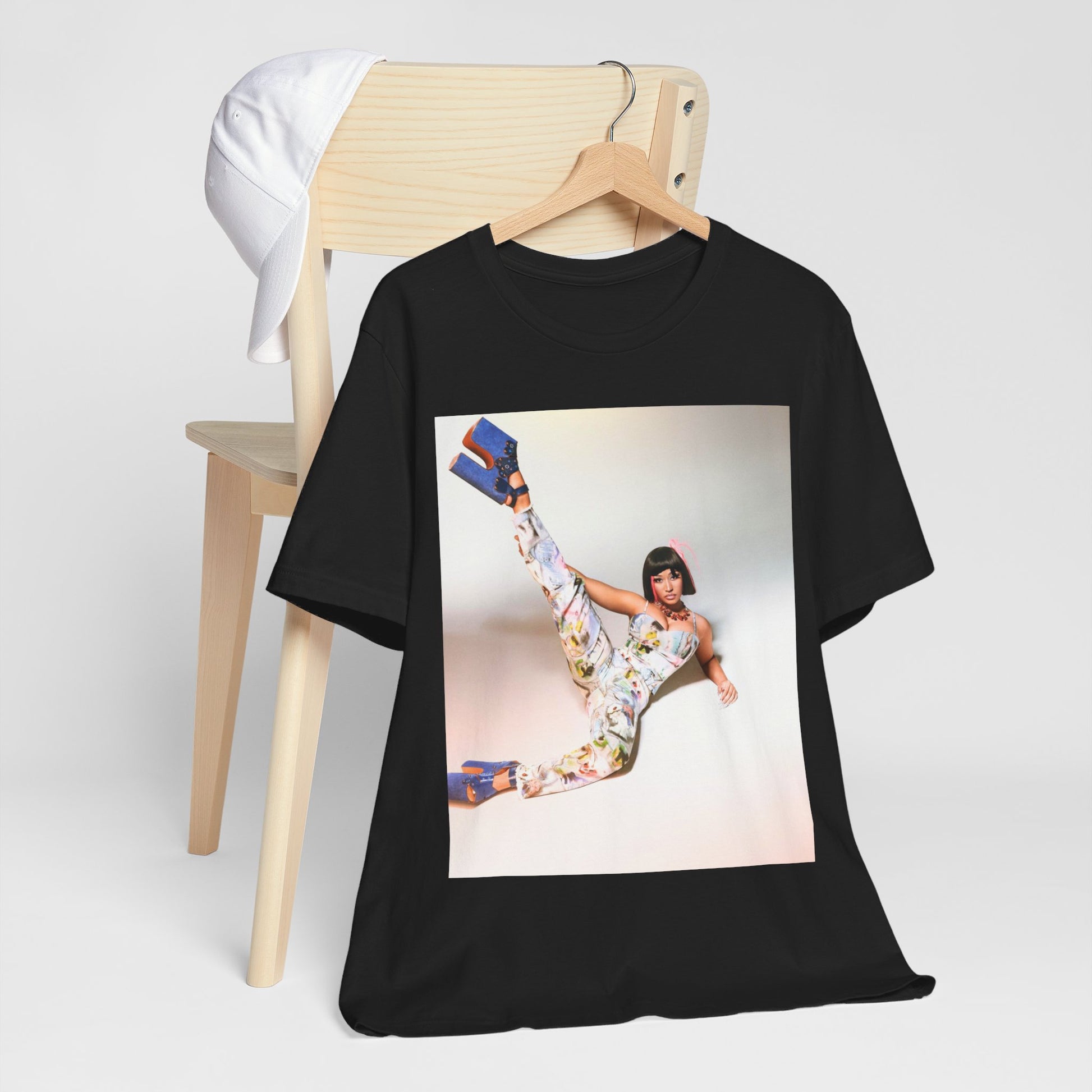 A black graphic t-shirt featuring a graphic of Nicki Minaj as a global fashion rap queen.