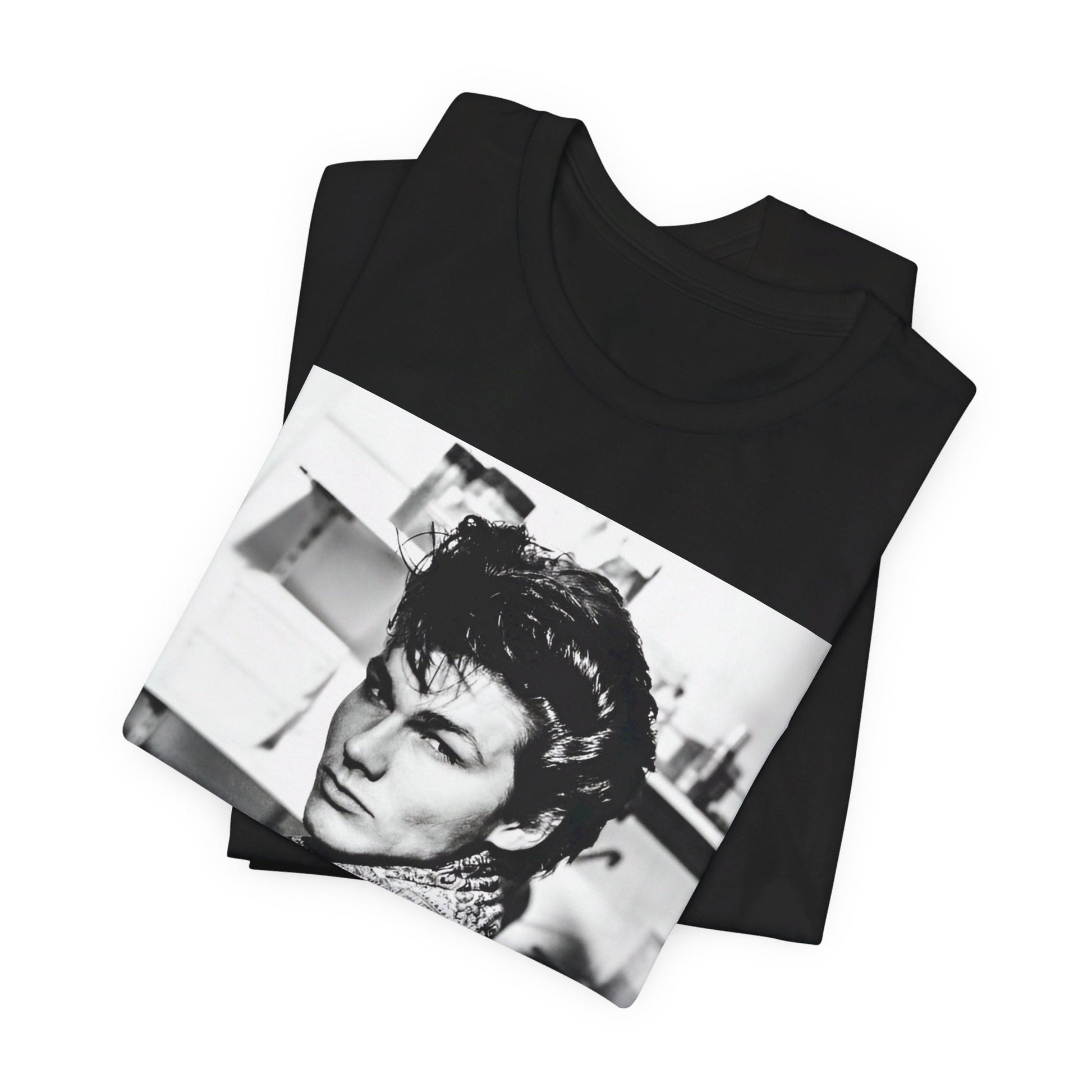 A black graphic t-shirt featuring a retro 1986-style graphic for the band A-HA, possibly with band members in a stylized design.