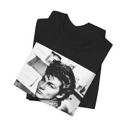 A black graphic t-shirt featuring a retro 1986-style graphic for the band A-HA, possibly with band members in a stylized design.