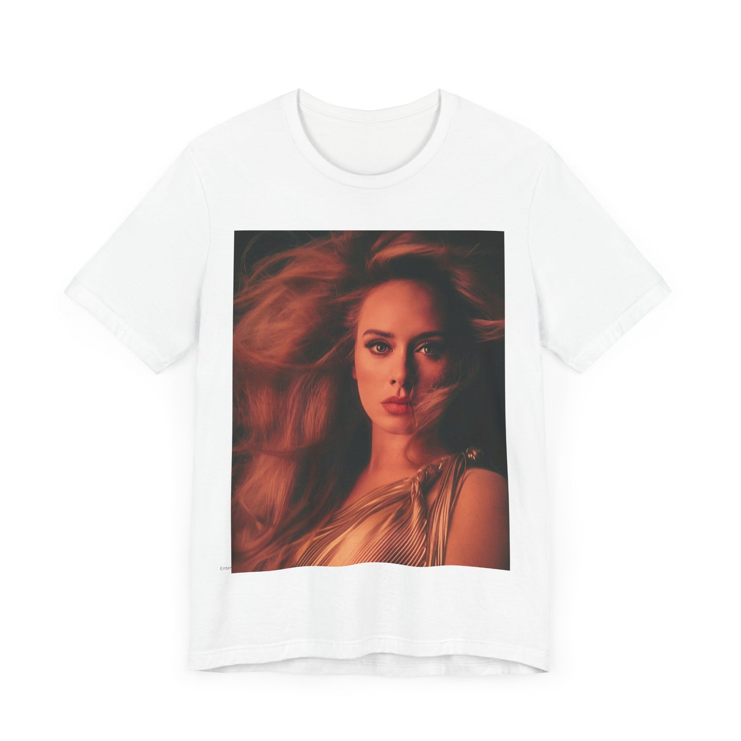 A black graphic t-shirt featuring a glamorous portrait of Adele wearing a golden gown, with voluminous hair, bathed in warm lighting, giving an editorial look.