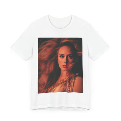 A black graphic t-shirt featuring a glamorous portrait of Adele wearing a golden gown, with voluminous hair, bathed in warm lighting, giving an editorial look.