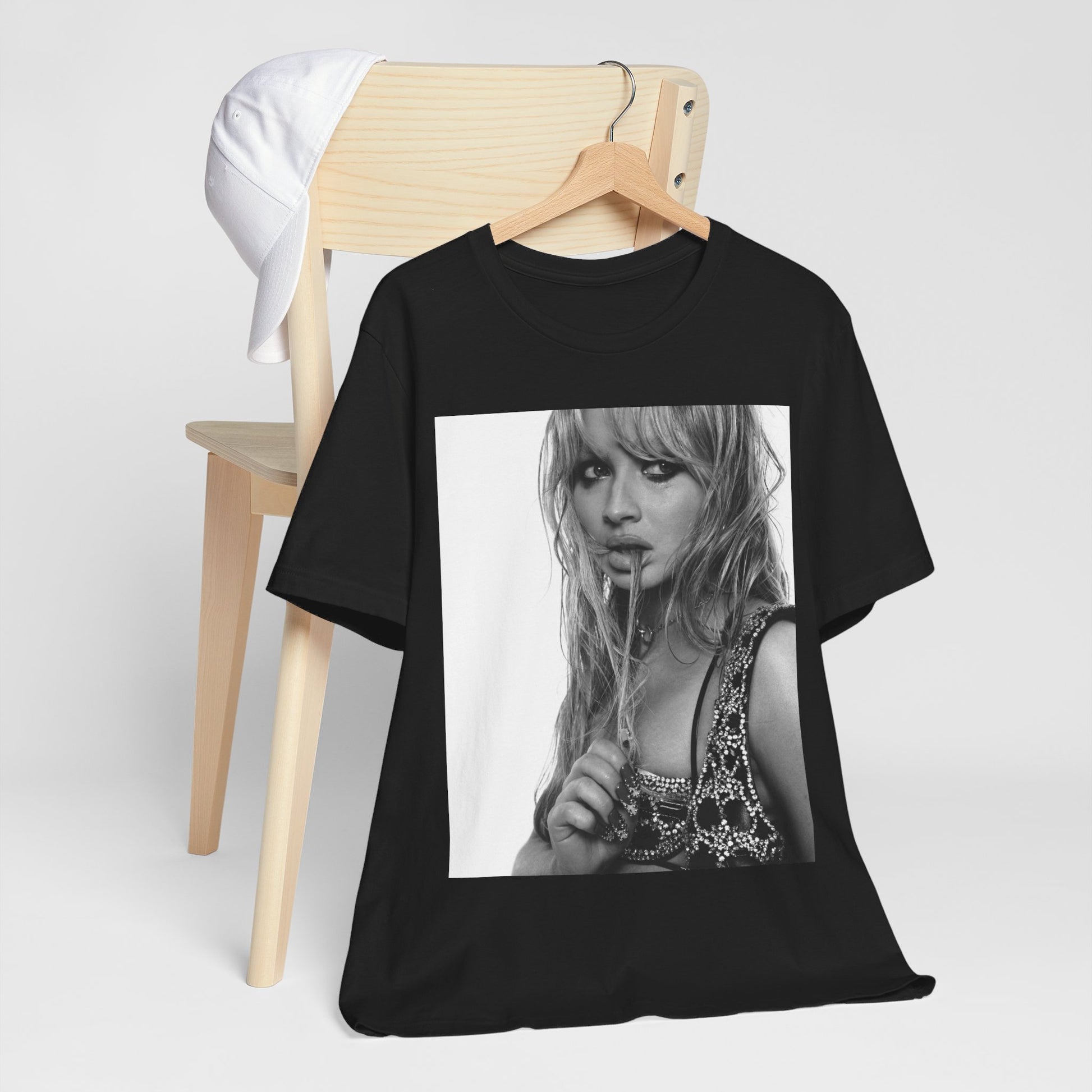 A black graphic t-shirt featuring a black and white portrait photo of Sabrina Carpenter.