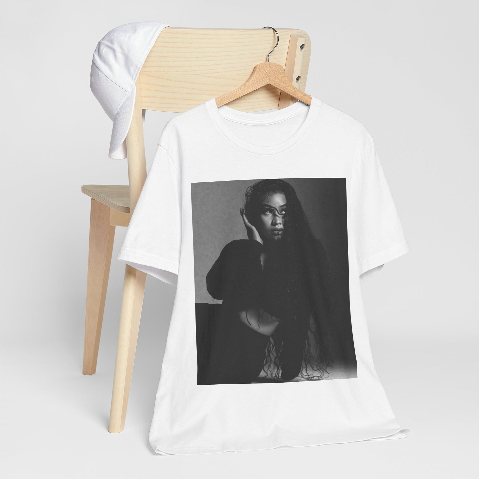 A black graphic t-shirt featuring a black and white graphic or photo of Nicki Minaj as a glamour queen.