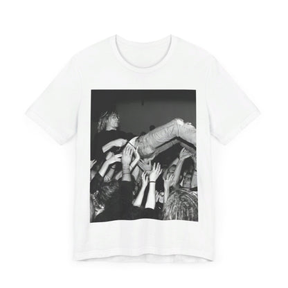 A black graphic t-shirt featuring a 90s graphic or photo of Kurt Cobain from Nirvana stage diving.