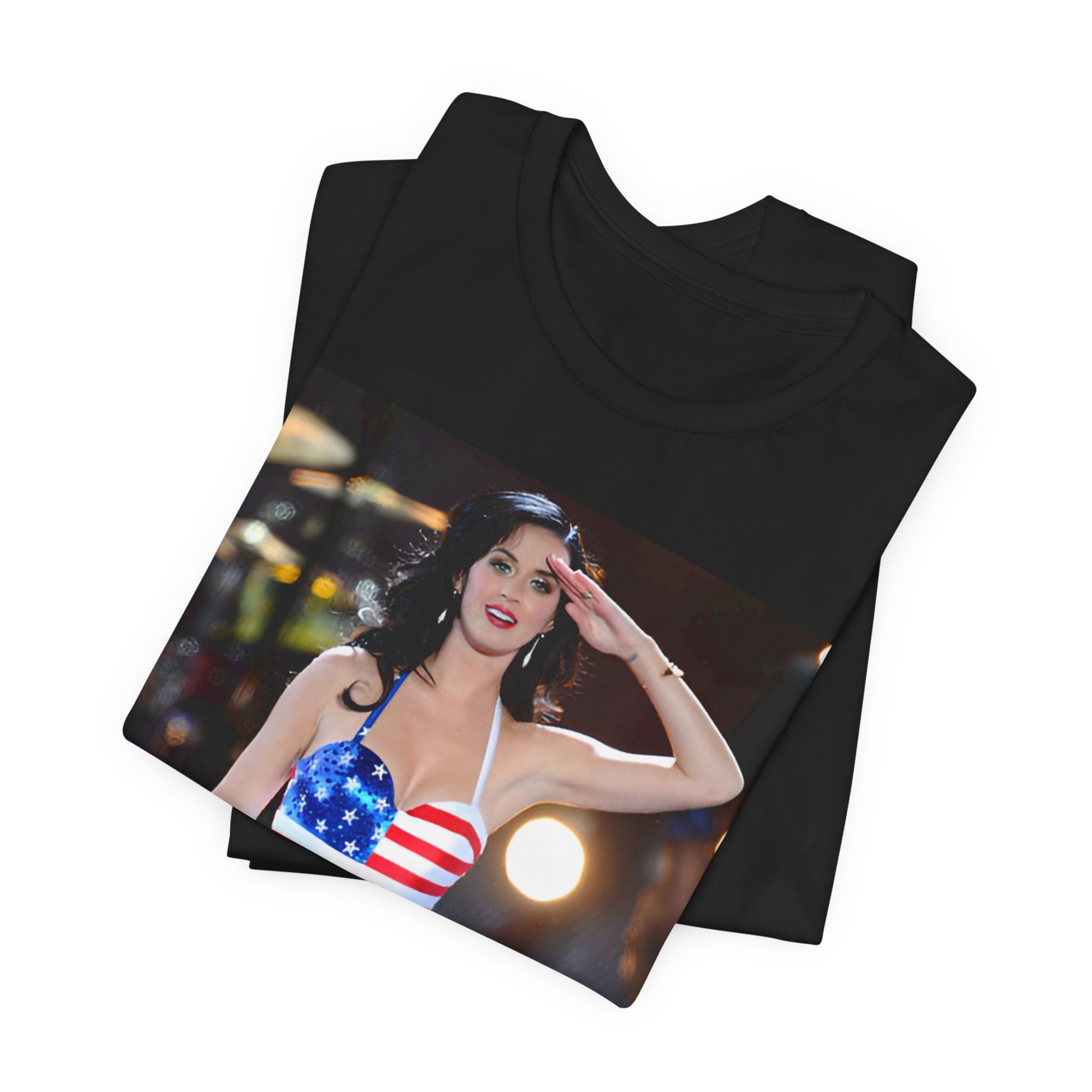 A black graphic t-shirt featuring a vintage graphic related to Katy Perry's 'Firework' song or era.