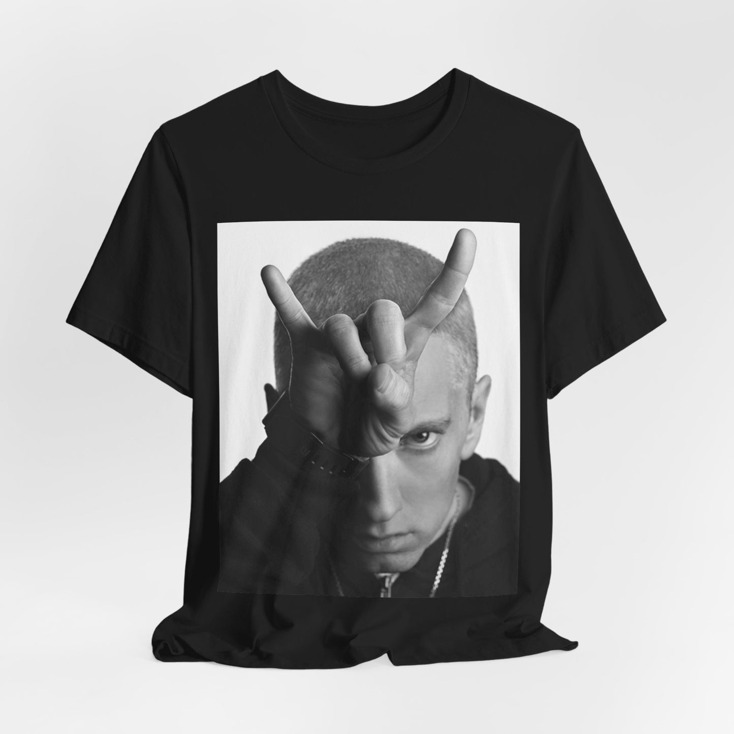A black graphic t-shirt featuring a graphic related to Eminem's 'My Name Is' song or era.