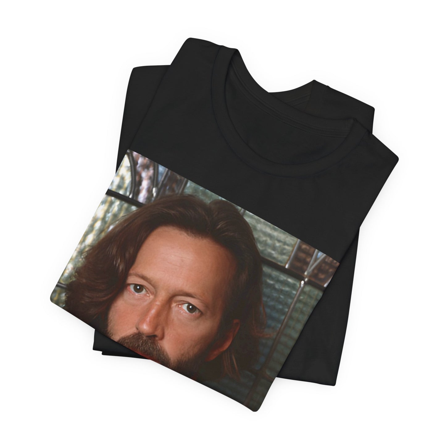 A black graphic t-shirt featuring a portrait graphic of Eric Clapton as a guitar god legend.