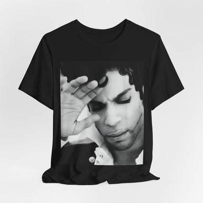 A black graphic t-shirt featuring a black and white graphic or photo portrait of Prince.