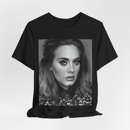 A black graphic t-shirt featuring a classic black and white, monochrome portrait of Adele, showing her with a serene or thoughtful expression.