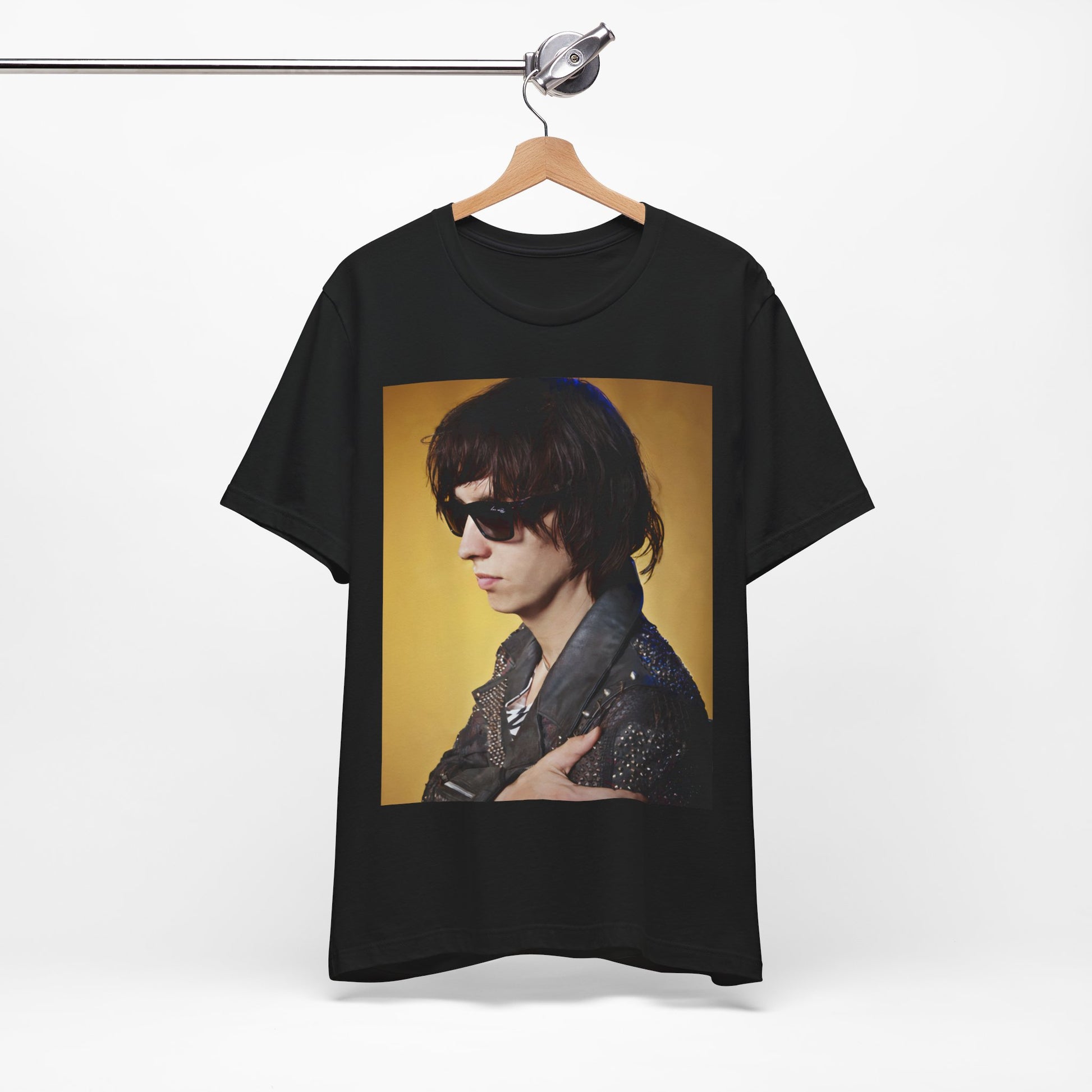 A black graphic t-shirt featuring a retro graphic related to The Strokes' 'Is This It' album era.