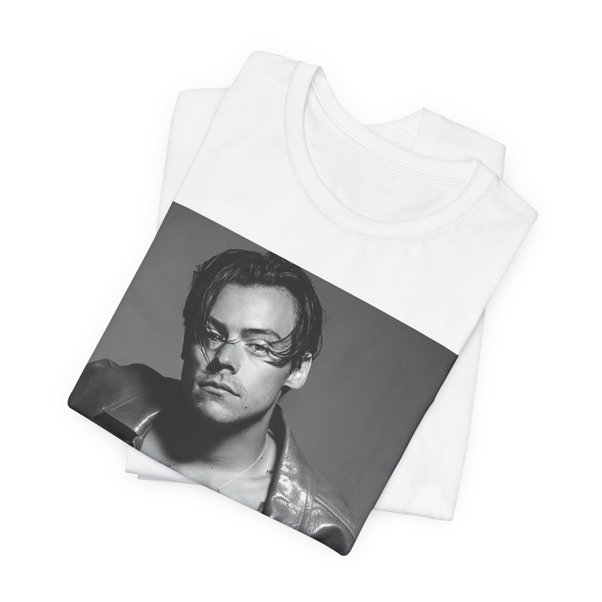 A black graphic t-shirt featuring a black and white portrait photo of Harry Styles.