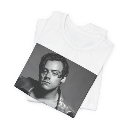 A black graphic t-shirt featuring a black and white portrait photo of Harry Styles.