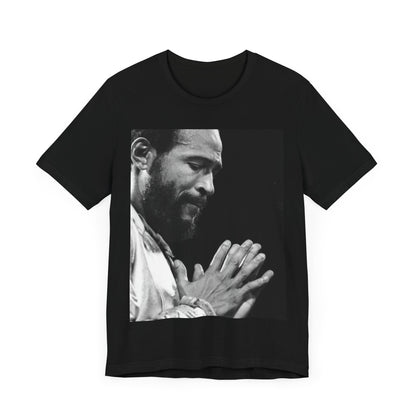A black graphic t-shirt featuring a 70s graphic of Marvin Gaye emphasizing his soulful voice.
