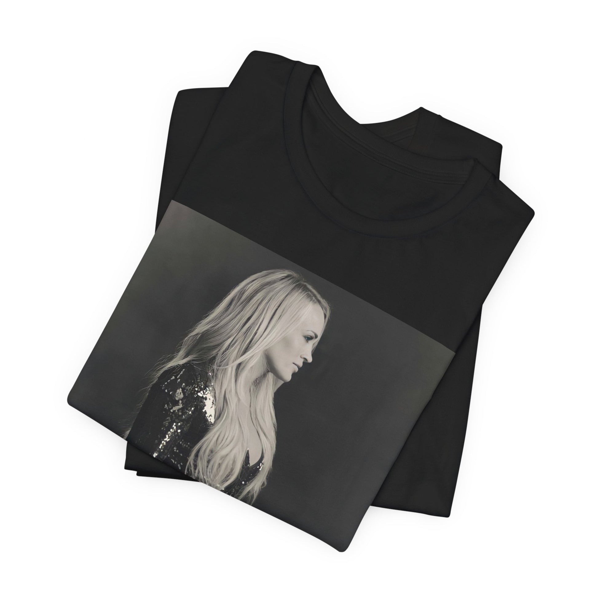A black graphic t-shirt featuring a black and white photo of Carrie Underwood performing live on stage.