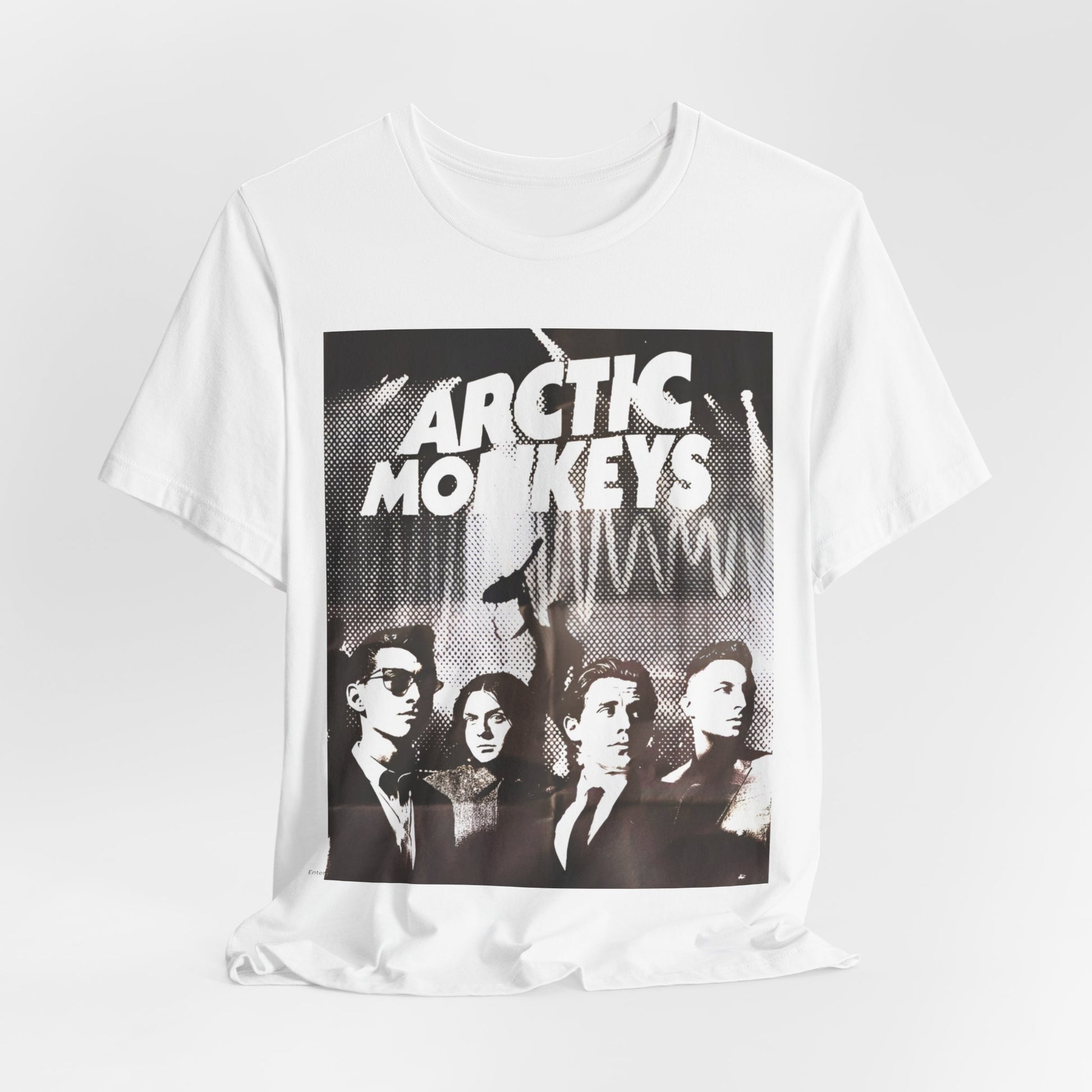 A black graphic t-shirt featuring a retro-style logo for the band Arctic Monkeys.