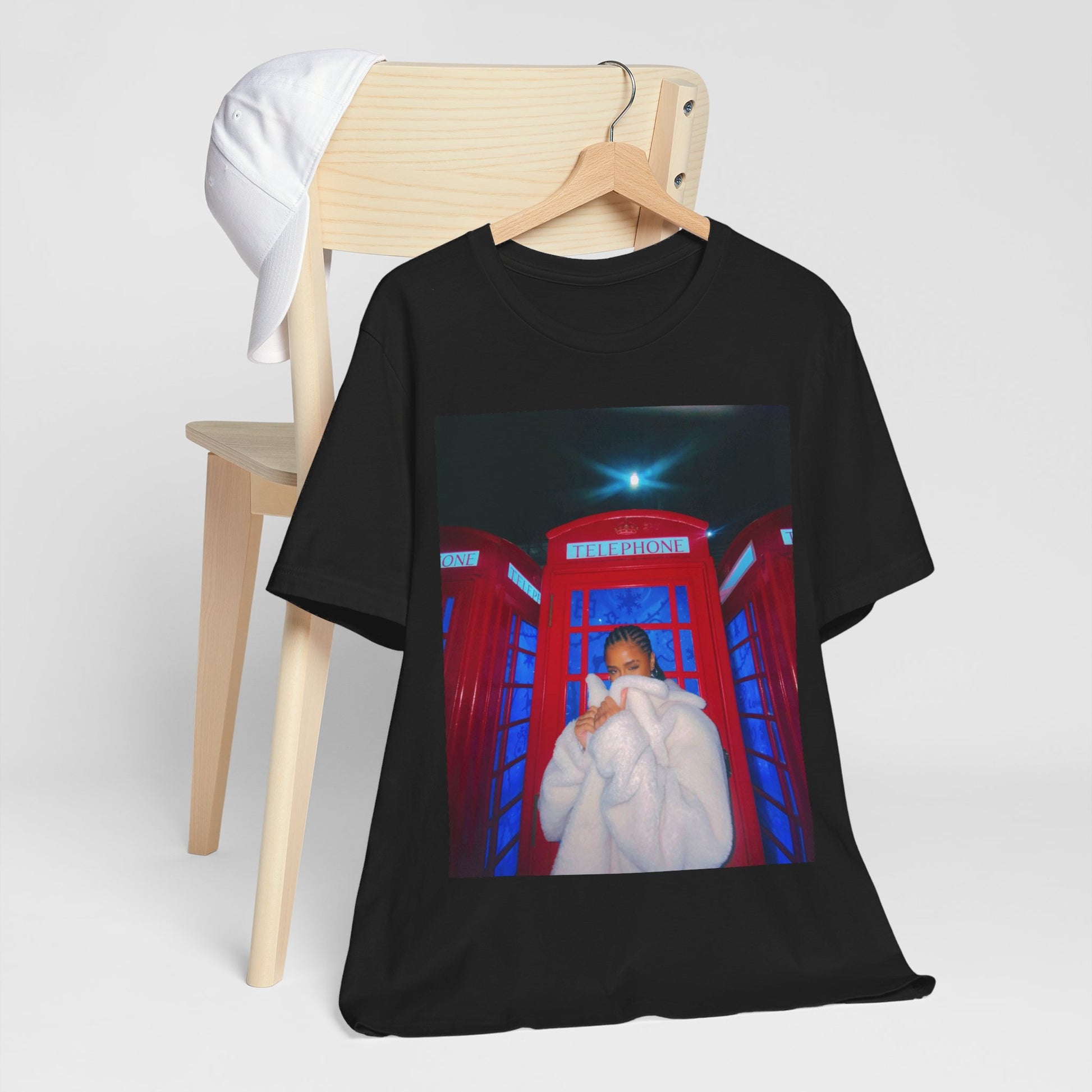 A black graphic t-shirt featuring a rhythmic dance pop graphic of Tyla.