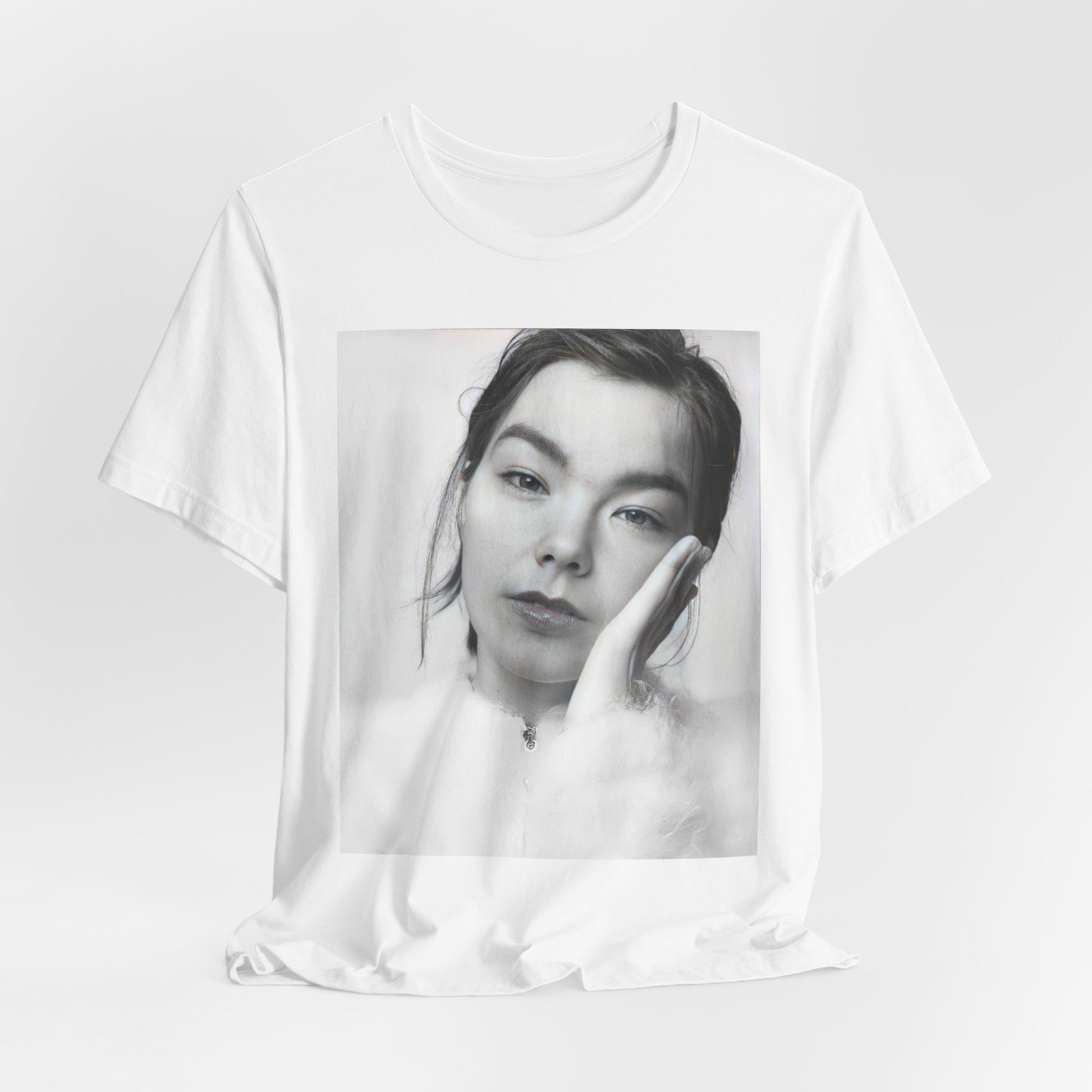 A black graphic t-shirt featuring a graphic related to Bjork's 'Post' album era, possibly with album art elements.