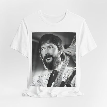 A black graphic t-shirt featuring a graphic of Eric Clapton as an authentic guitar god.