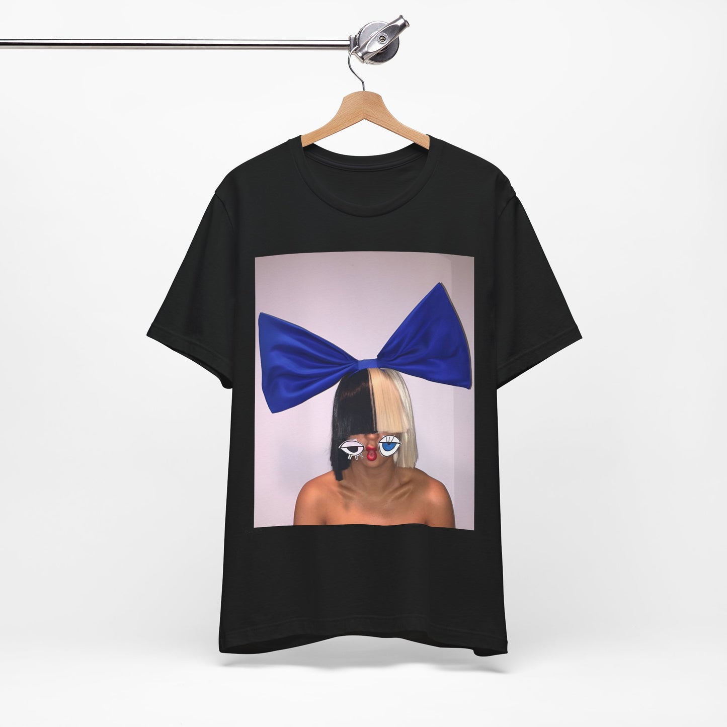 A black graphic t-shirt featuring a graphic of Sia with her iconic wig, in an aesthetic style.