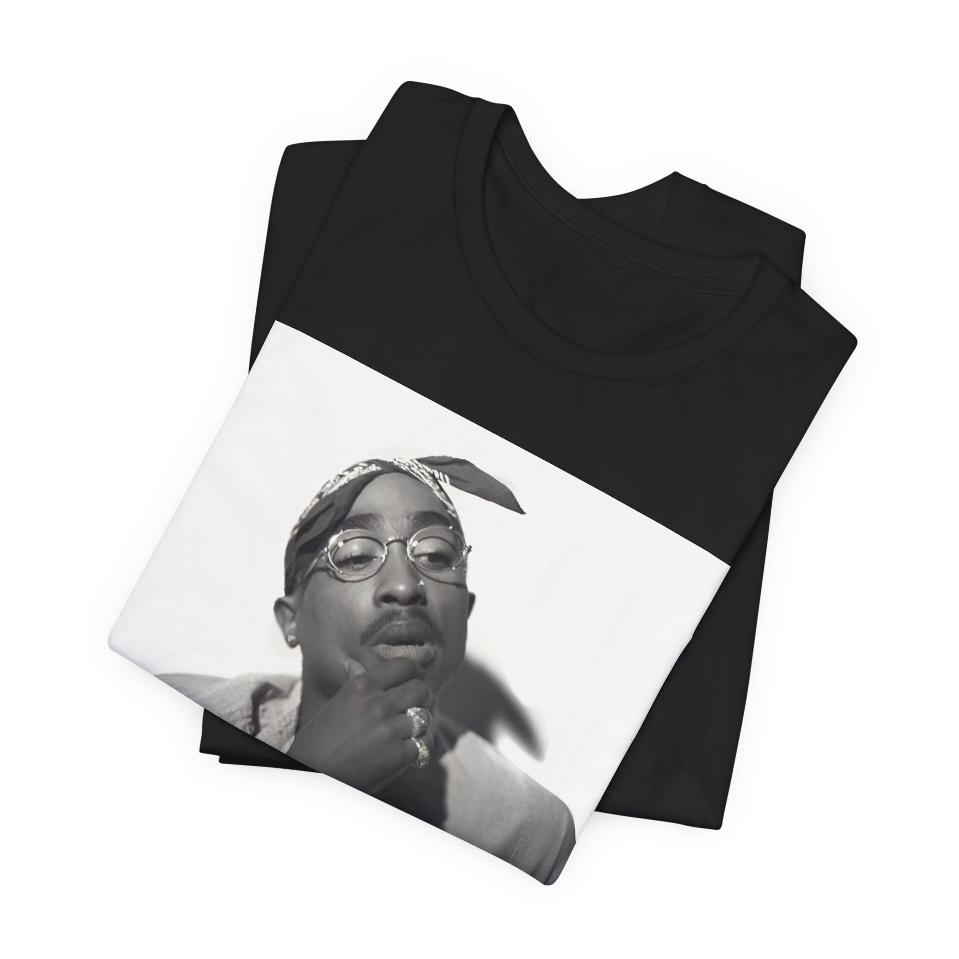 A black graphic t-shirt featuring a classic 90s West Coast rap graphic of Tupac.