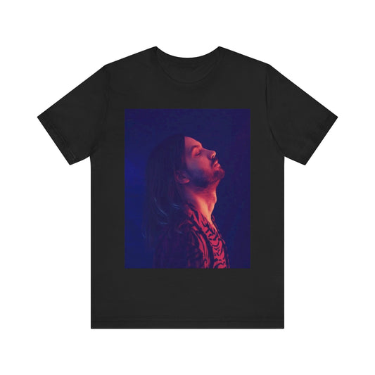 A black graphic t-shirt featuring a retro indie alt-rock graphic of Tame Impala.