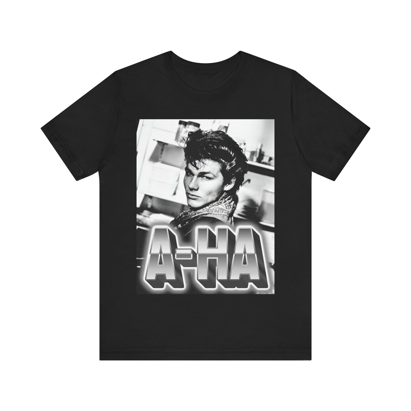 A black graphic t-shirt featuring a retro 1986-style graphic for the band A-HA, possibly with band members in a stylized design.