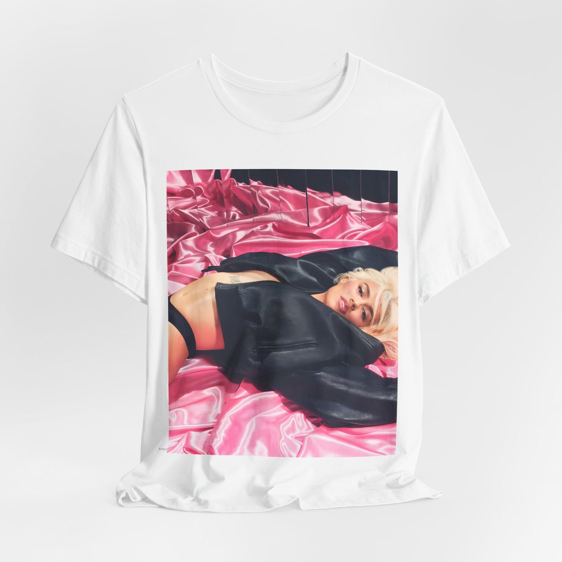 A black graphic t-shirt featuring a vintage aesthetic graphic related to Karol G's 'Tusa' era.