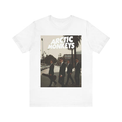 A black graphic t-shirt featuring Arctic Monkeys in a pose or setting similar to the iconic 'Abbey Road' album cover.