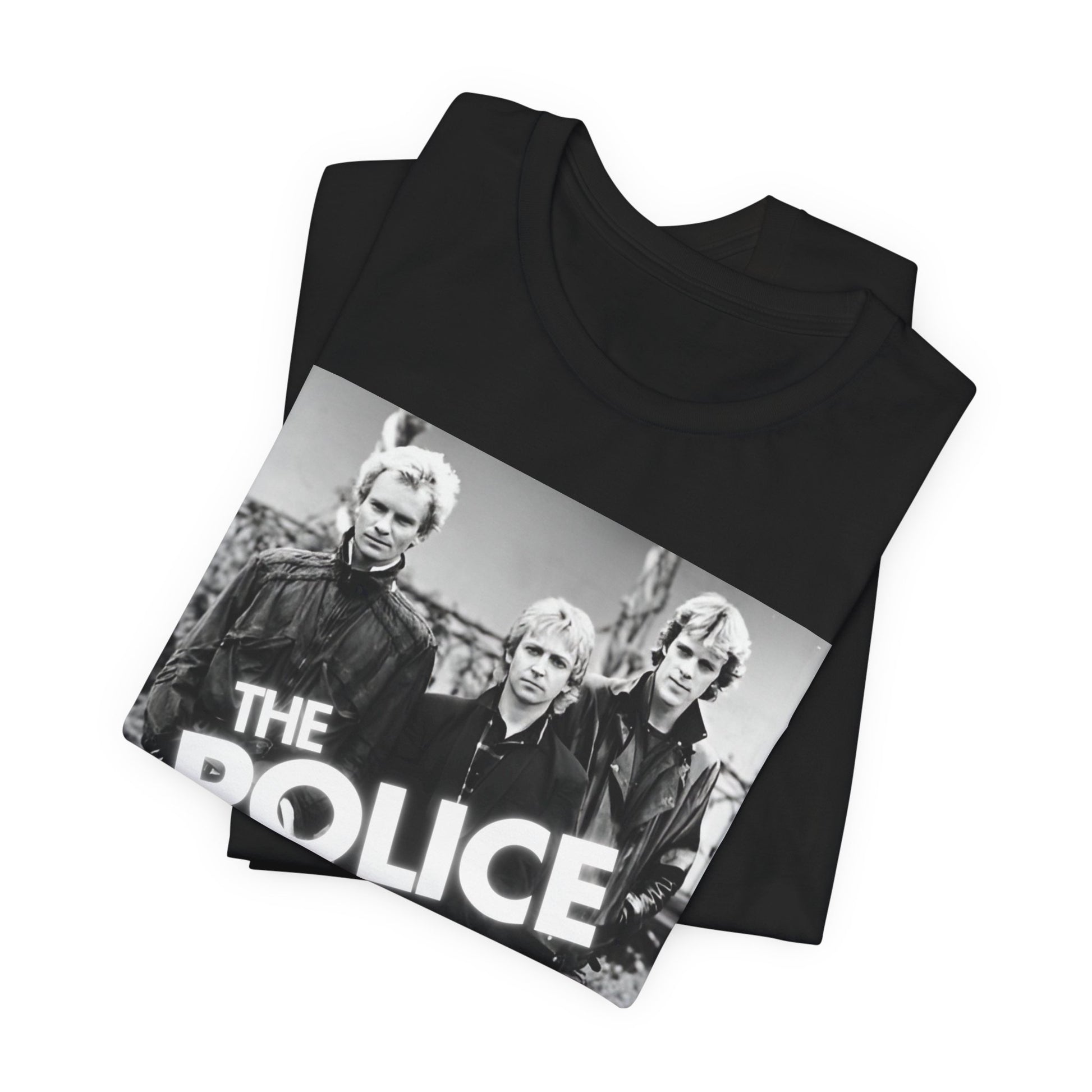 A black graphic t-shirt featuring an 80s pop rock aesthetic black and white graphic of The Police.