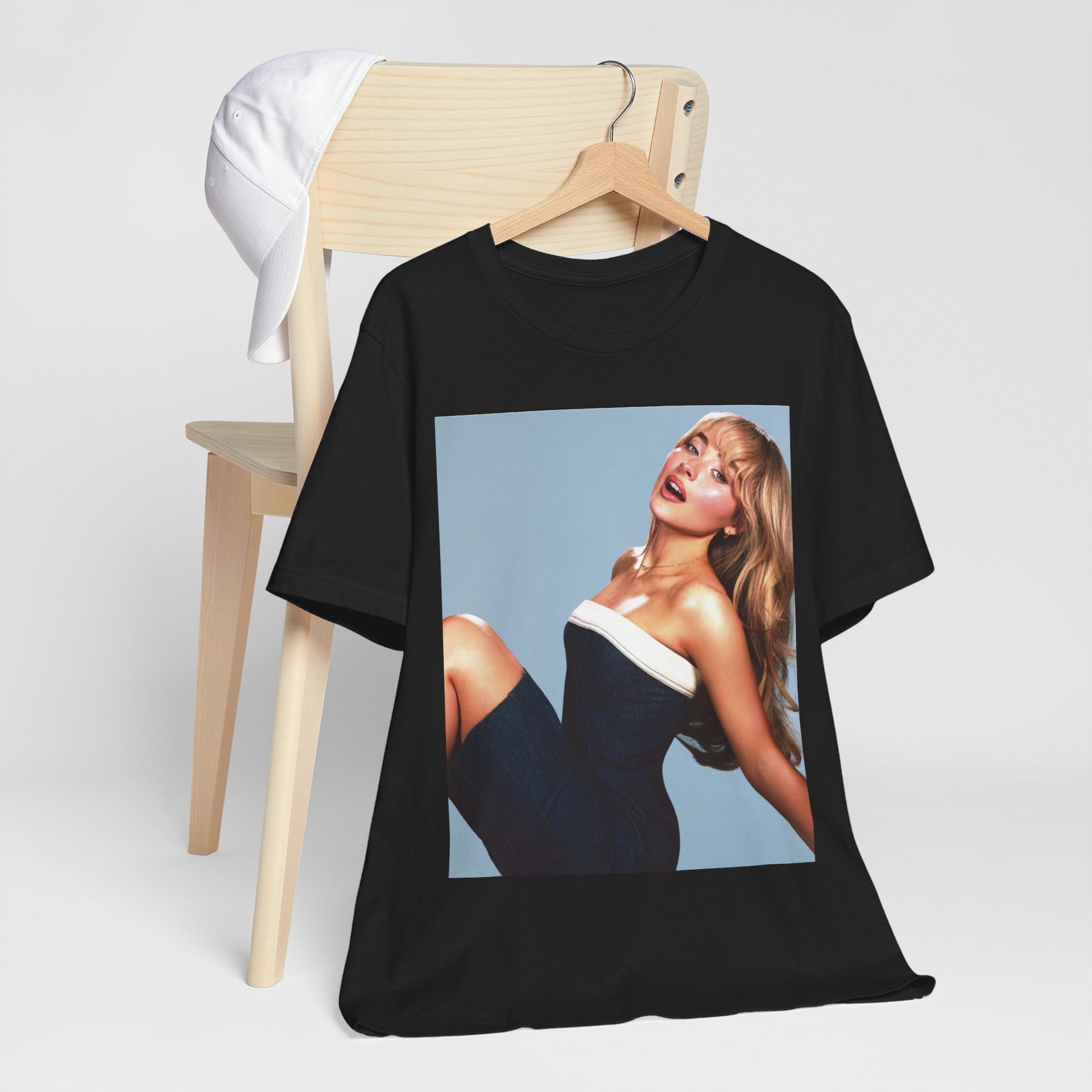 A black graphic t-shirt featuring a graphic related to Sabrina Carpenter's 'Espresso' song or era.