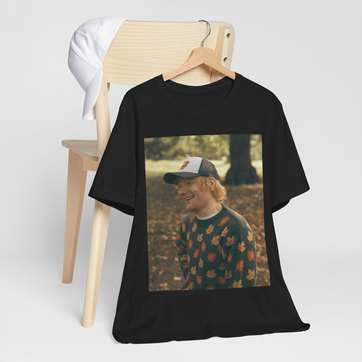 A black graphic t-shirt featuring a graphic related to Ed Sheeran's 'Shape of You' song or era.
