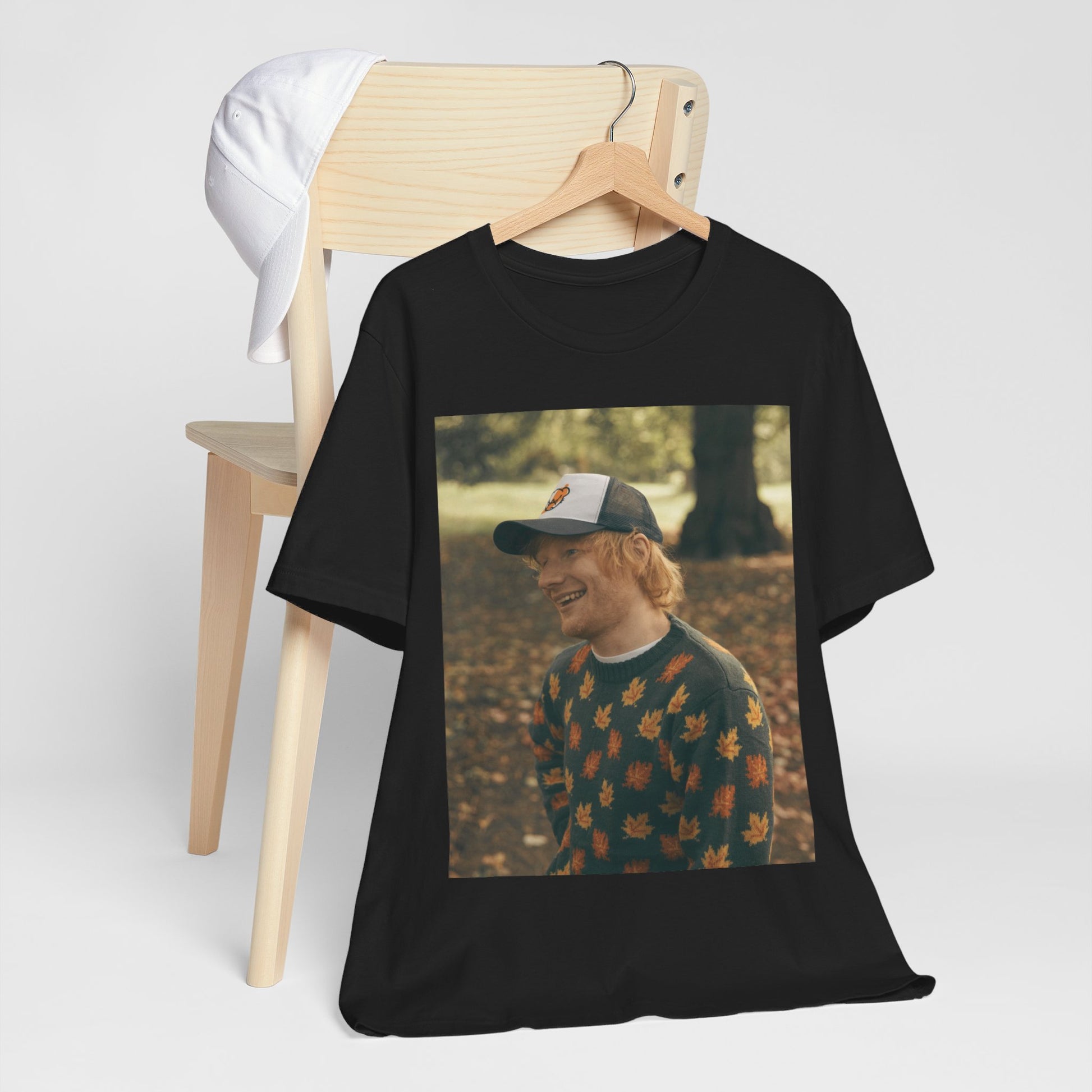 A black graphic t-shirt featuring a graphic related to Ed Sheeran's 'Shape of You' song or era.
