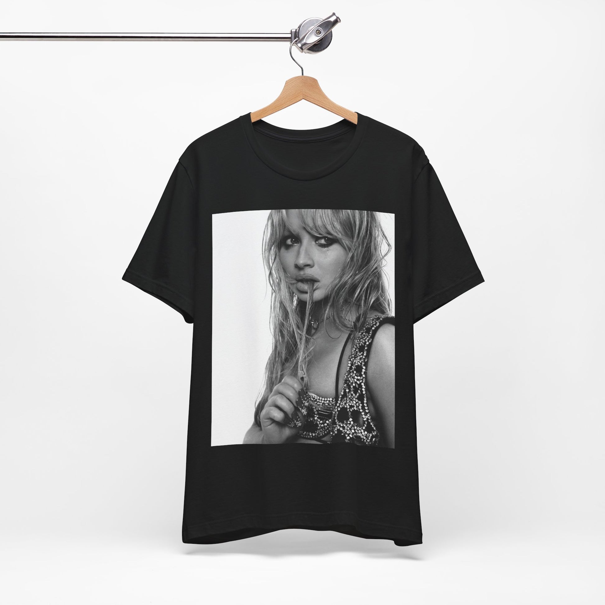 A black graphic t-shirt featuring a black and white portrait photo of Sabrina Carpenter.