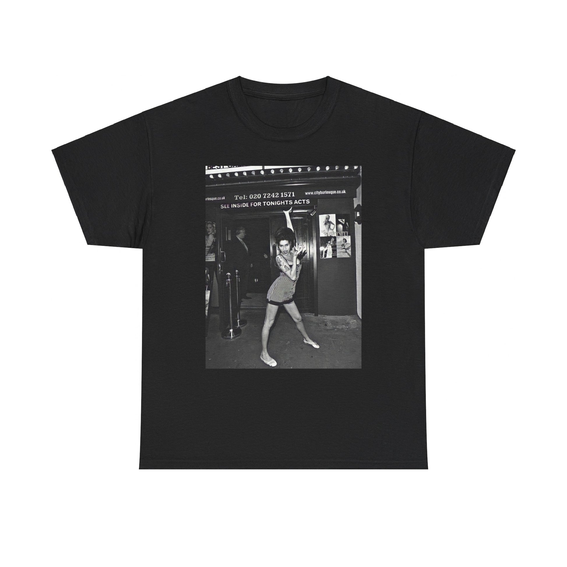 A black graphic t-shirt featuring a black and white graphic of Amy Winehouse in a burlesque club setting, stylized to evoke that ambiance.