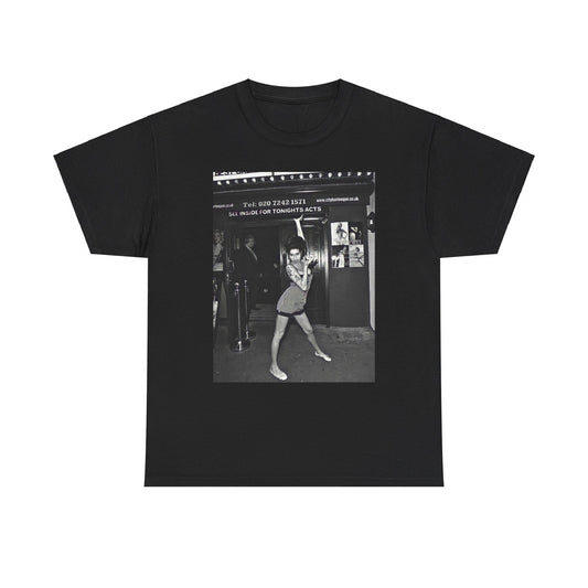 A black graphic t-shirt featuring a black and white graphic of Amy Winehouse in a burlesque club setting, stylized to evoke that ambiance.