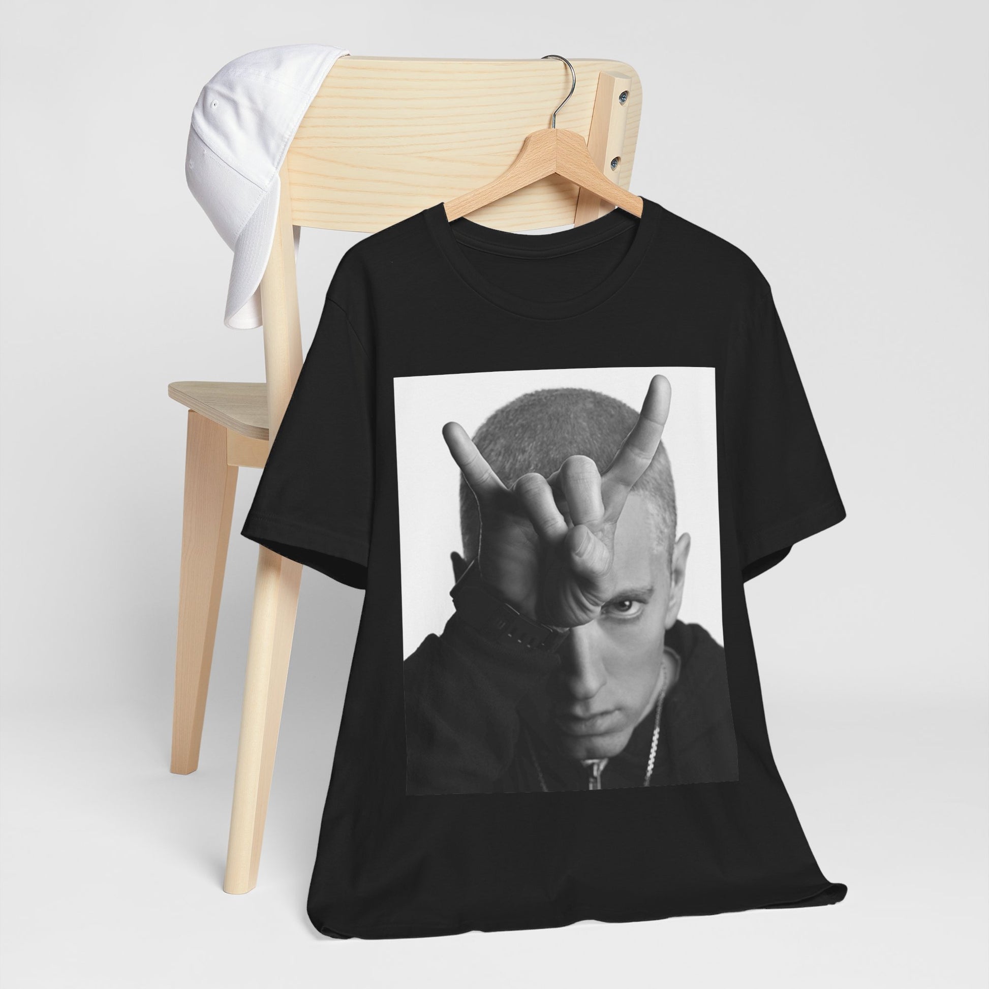 A black graphic t-shirt featuring a graphic related to Eminem's 'My Name Is' song or era.