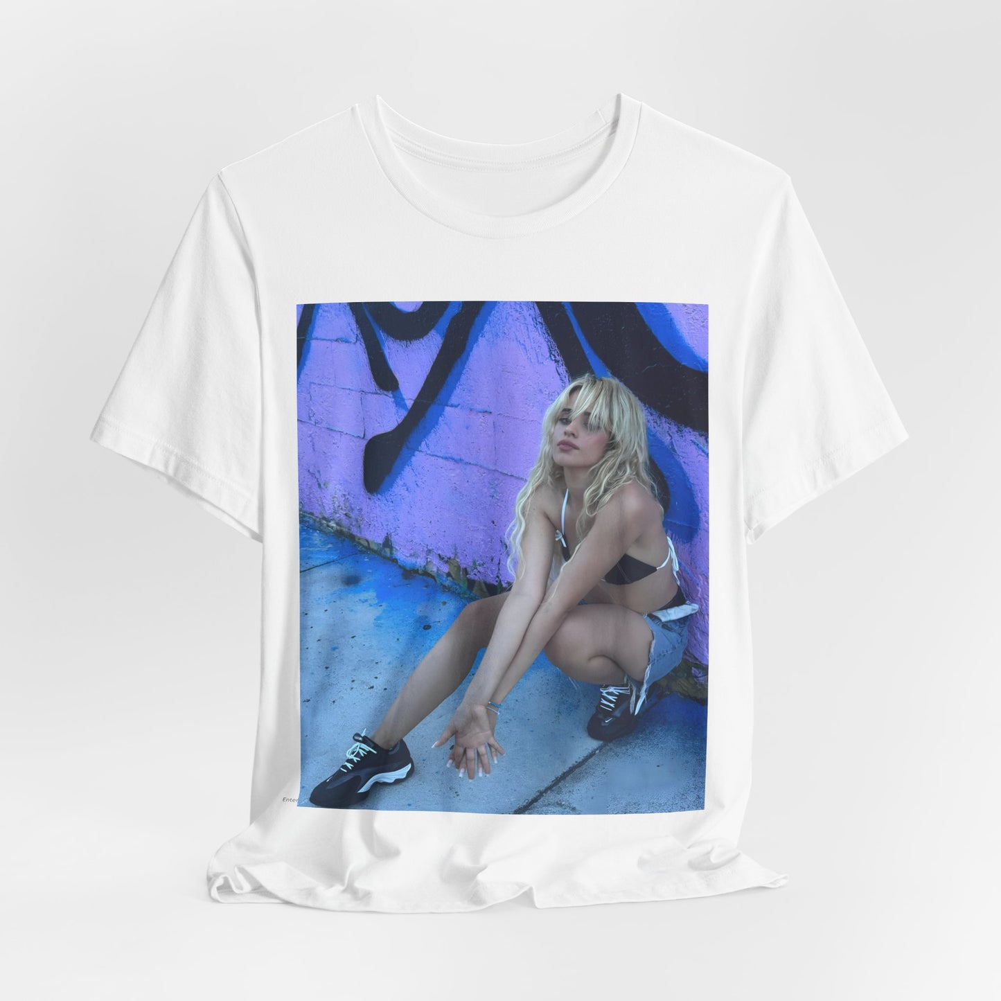 A black graphic t-shirt featuring a photo of Camila Cabello from her "Romance" album era.