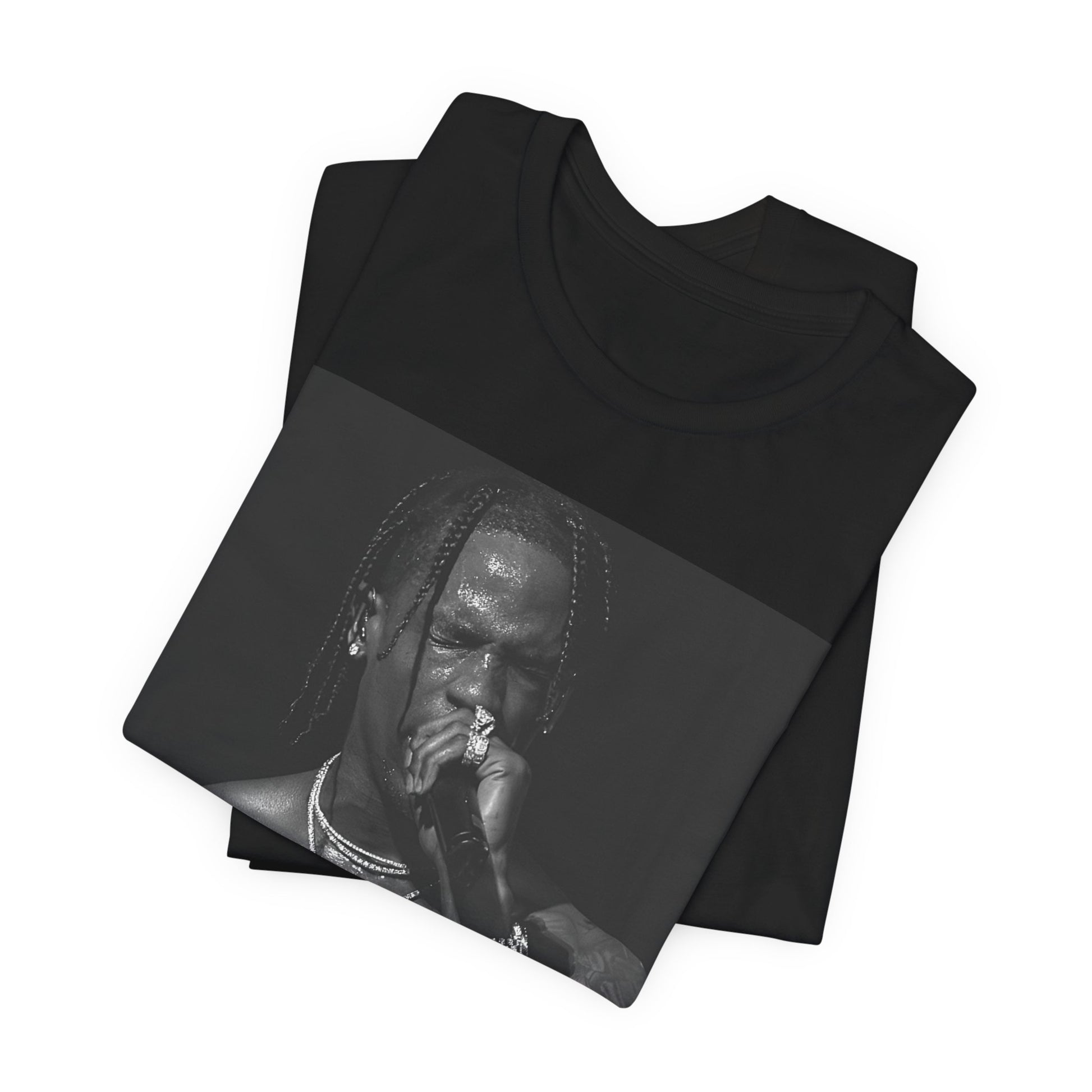 A black graphic t-shirt featuring an underground hip hop graphic of Travis Scott.