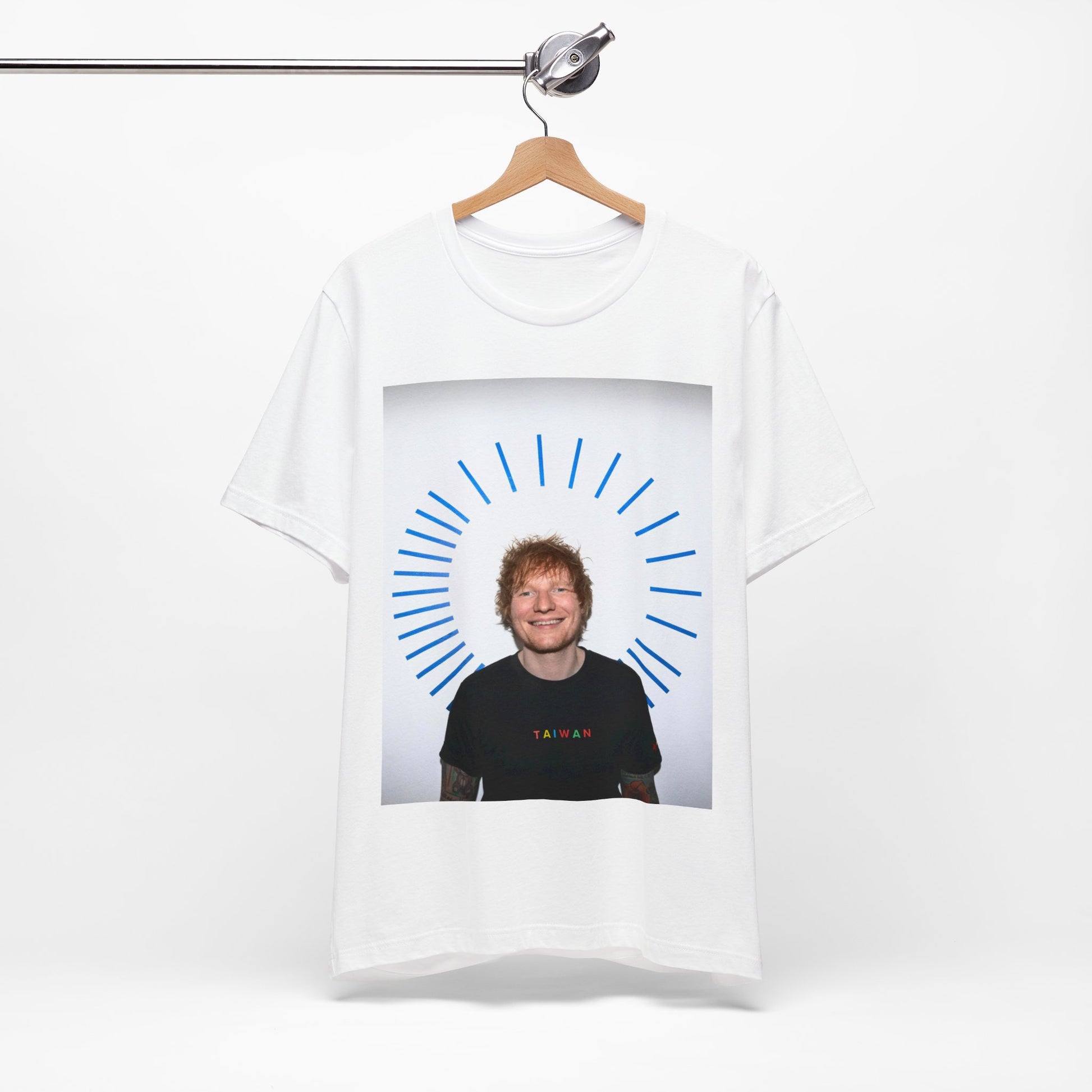 A black graphic t-shirt featuring a classic photo portrait of Ed Sheeran in a folk-pop style.