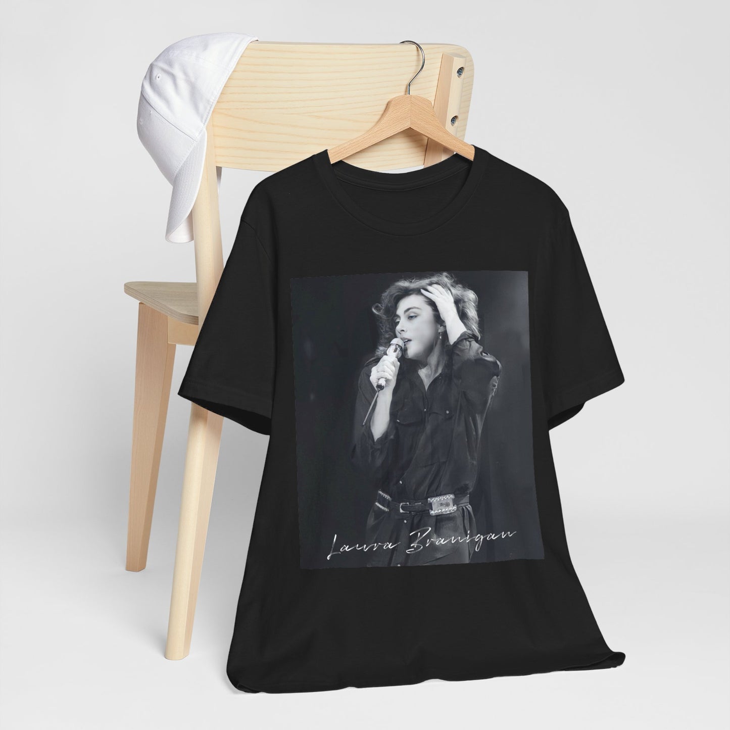 A black graphic t-shirt featuring an 80s live show graphic of Laura Branigan.
