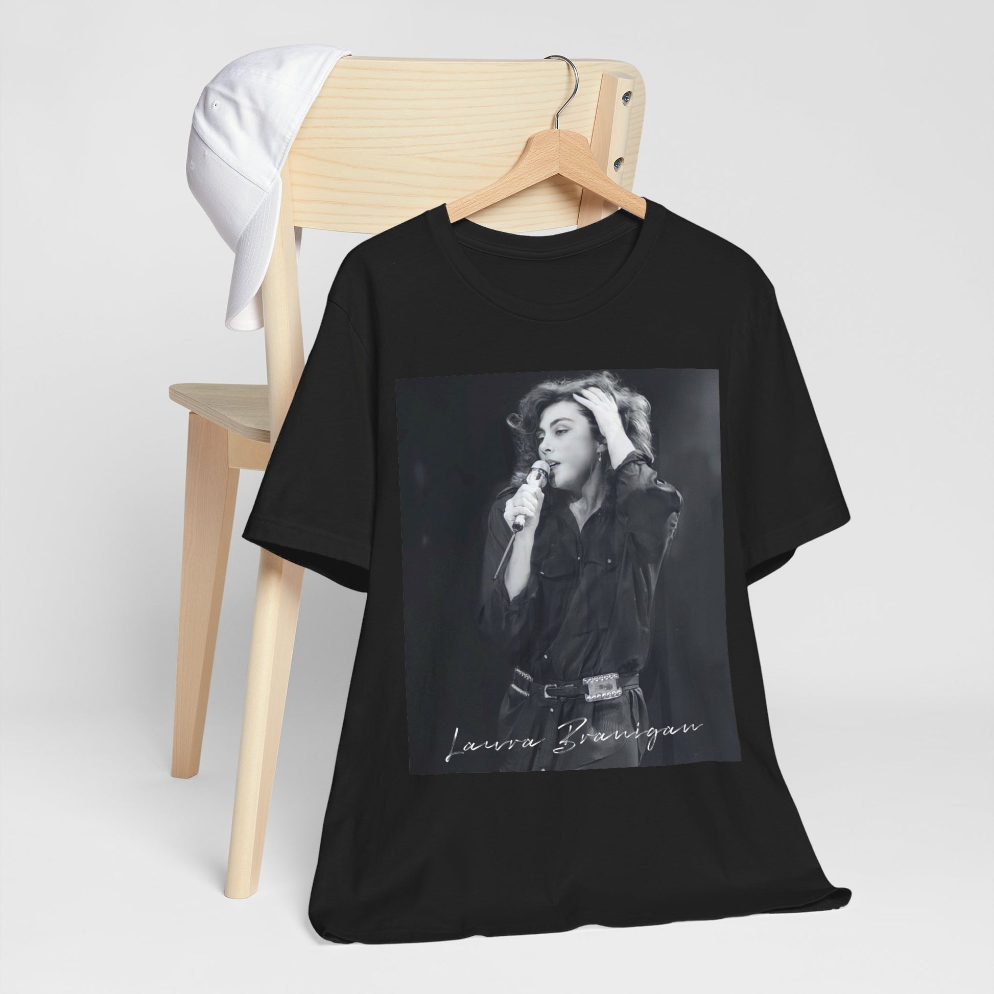 A black graphic t-shirt featuring an 80s live show graphic of Laura Branigan.