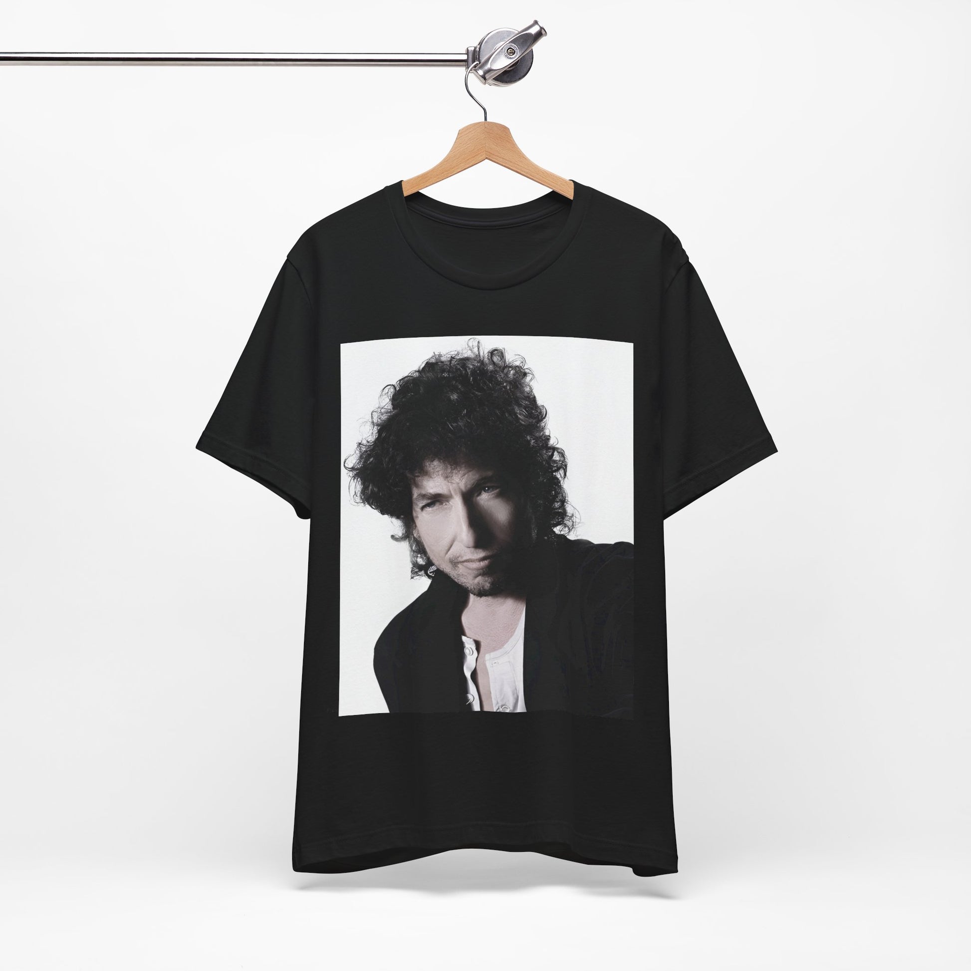A black graphic t-shirt featuring a timeless folk rock graphic of Bob Dylan, possibly with his guitar or harmonica.