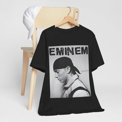 A black graphic t-shirt featuring a stylized graphic of Eminem as a modern rap legend.