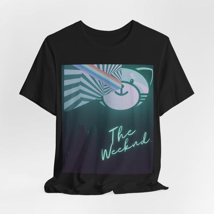 A black graphic t-shirt featuring a vintage concert graphic of The Weeknd from his 'Kiss Land' era.